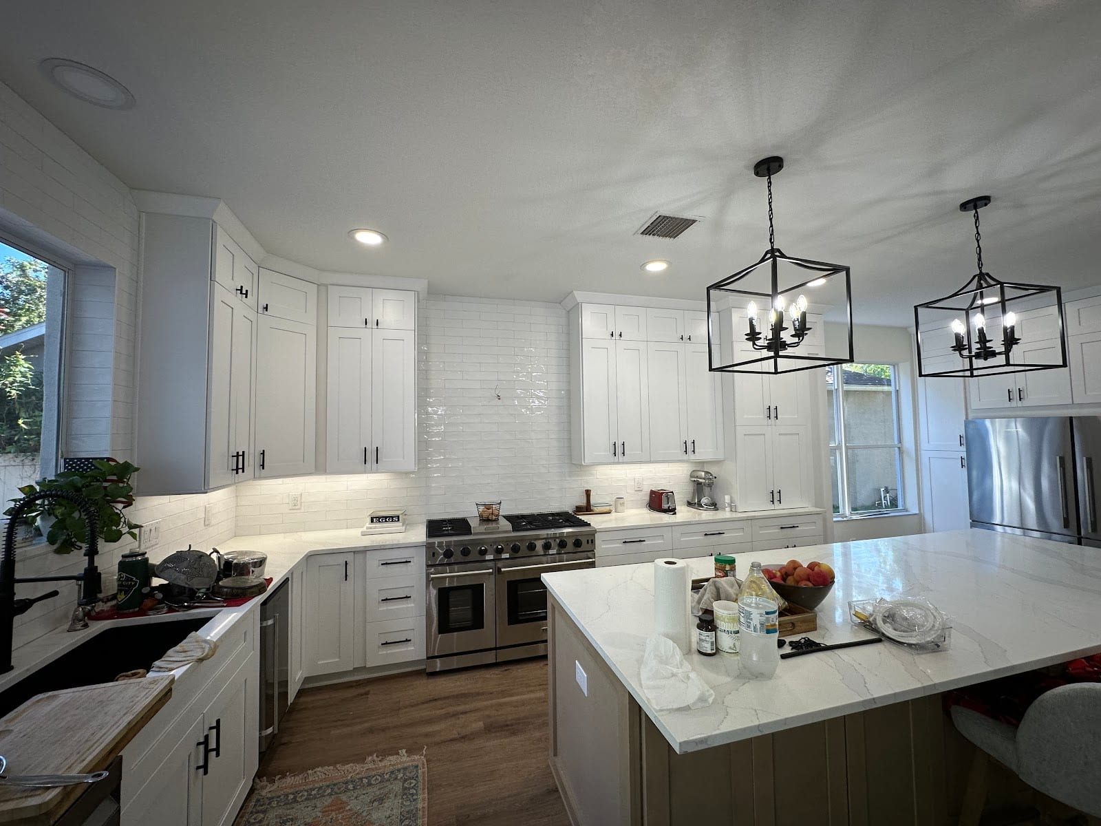 Kitchen remodel wired by Lightning Bay Electric, a residential electrician in Tampa, FL: lantern pendants, recessed cans, under-cabinet LEDs and range circuit