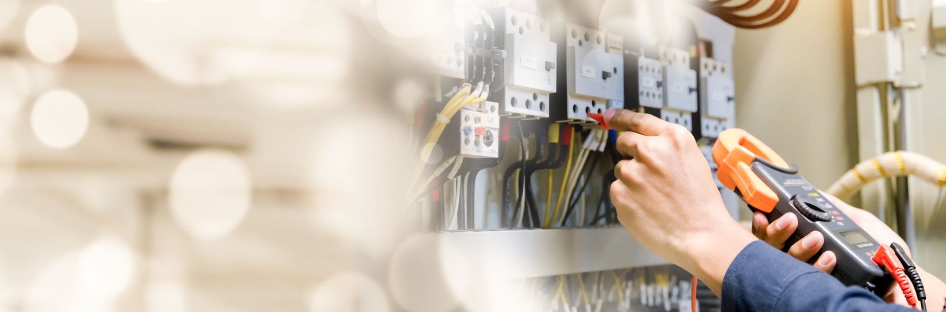 Lightning Bay Electric electrician using a clamp meter during an electrical safety inspection of a panel in Tampa Bay, FL