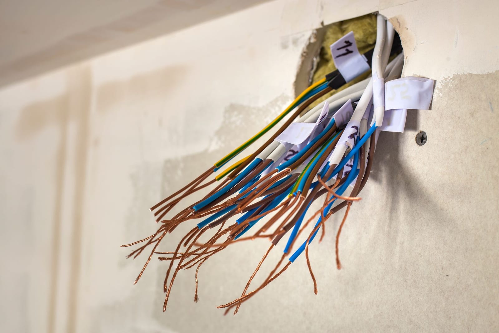 Exposed damaged wiring being made safe during an emergency electrical repair by Lightning Bay Electric in Tampa, FL